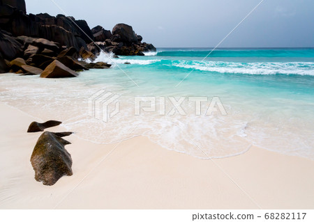 Big rocks on the beach with white sand Big rocks on the beach with white sand 68282117