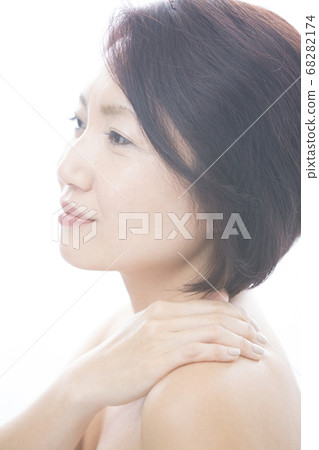 A woman with stiff shoulders A woman with stiff shoulders 68282174