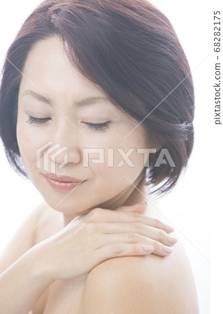A woman with stiff shoulders A woman with stiff shoulders 68282175