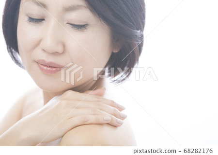 A woman with stiff shoulders A woman with stiff shoulders 68282176