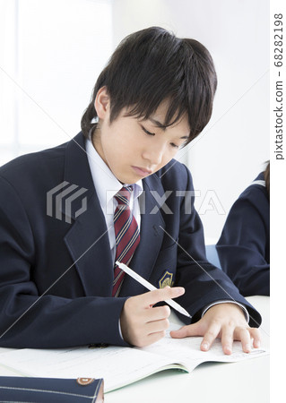 Junior high school boys studying at cram school Junior high school boys studying at cram school 68282198
