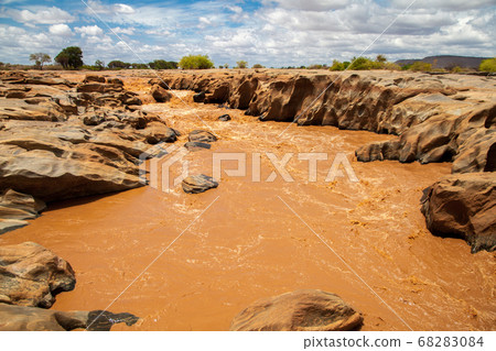 Galana river in Kenya, blue sky with clouds Galana river in Kenya, blue sky with clouds 68283084