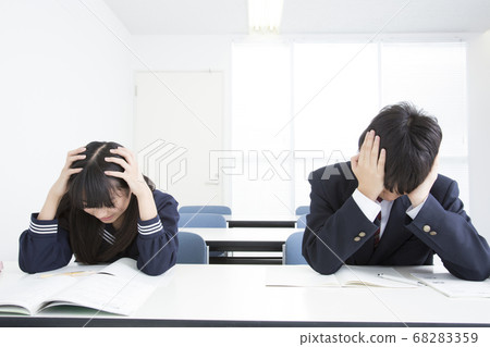 Junior high school student holding a head Junior high school student holding a head 68283359