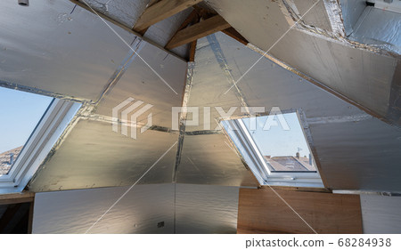 Unfinished residential loft conversion with silver insulation Unfinished residential loft conversion with silver insulation 68284938