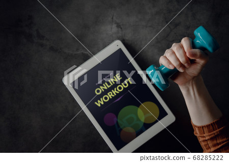 Online Workout Concept. Young Woman with Dumbbell 68285222