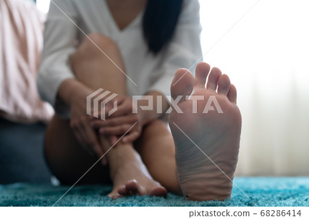 foot ankle injury pain women touch her foot painful, healthcare and medicine concept 68286414
