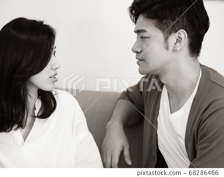 Young woman and man Have Disagreement in black and Young woman and man Have Disagreement in black and 68286466