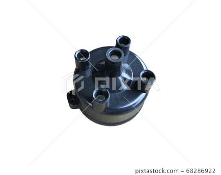 New car ignition distributor cap on an isolated white background. Spare parts. New car ignition distributor cap on an isolated white background. Spare parts. 68286922