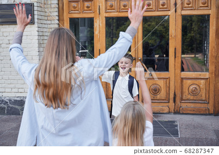 Merry family meeting together outdoors during week day Merry family meeting together outdoors during week day 68287347