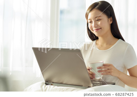 Young men relaxing in the bedroom Young men relaxing in the bedroom 68287425