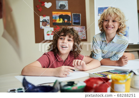 Happy boys enjoying painting classes at school Happy boys enjoying painting classes at school 68288251