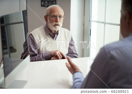 Elderly patient showing up for a doctors appointment 68288921