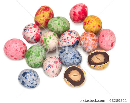 Peanutes in chocolate and glaze on white background Peanutes in chocolate and glaze on white background 68289221