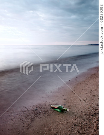 Bottle with message on sea coast Bottle with message on sea coast 68289398