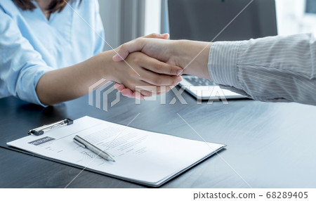 hands shake after business office executives are interviewing job applicants in the meeting room hands shake after business office executives are interviewing job applicants in the meeting room 68289405