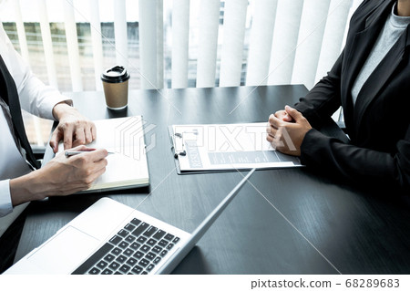 Office executives are interviewing job applicants in the meeting room Office executives are interviewing job applicants in the meeting room 68289683
