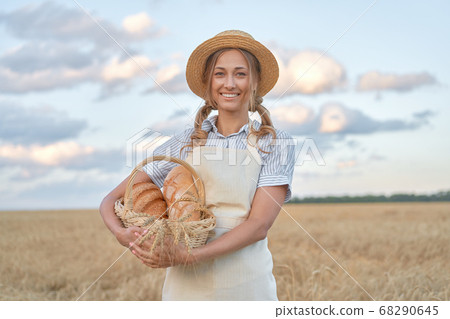 Female farmer standing wheat agricultural field Female farmer standing wheat agricultural field 68290645