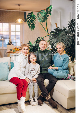 happy friendly family sitting on the couch 68291635