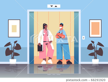 mix race medical workers discussing during meeting in hospital elevator healthcare medicine concept mix race medical workers discussing during meeting in hospital elevator healthcare medicine concept 68291920