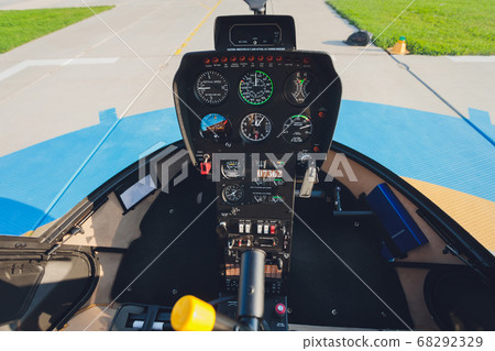 Helicopter dashboard close up. Helicopter Robinson r44 inside the cockpit view. Helicopter dashboard close up. Helicopter Robinson r44 inside the cockpit view. 68292329
