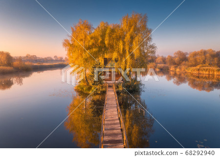 Old fisherman house and wooden pier at sunrise in 68292940