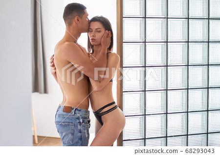 young handsome man kissing his wife's forehead. I love you , baby young handsome man kissing his wife's forehead. I love you , baby 68293043