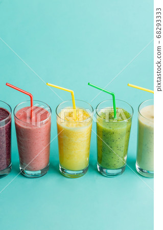 juice with diffrrent tastse on the bluew background. juice with diffrrent tastse on the bluew background. 68293333
