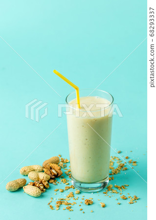 tasty milkshake in glass with straw 68293337