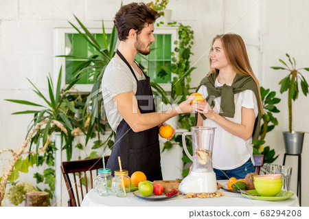 young emotional amorous people in the kitchen 68294208