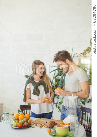 awesome young people are having fun while peeling fruits 68294796