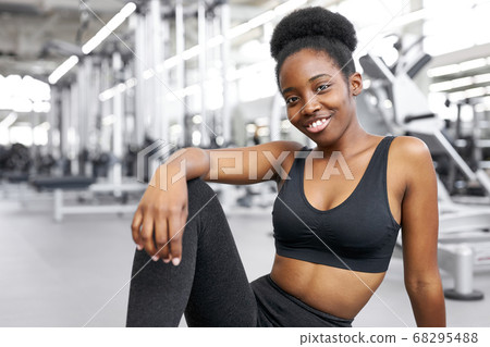 portrait of adorable african lady sitting in gym portrait of adorable african lady sitting in gym 68295488
