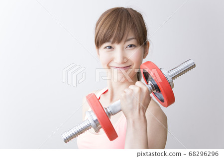 Women doing weight training Women doing weight training 68296296
