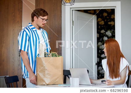 man expresses dissatisfaction, he does all the chores while his wife works 68296598