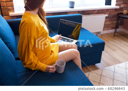 unrecognizable pregnant woman going to surf the net 68296643
