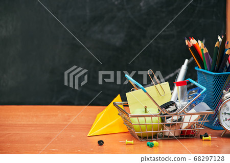 school still life, alarm clock, stand for pencils on the background of a school board, university, college 68297128