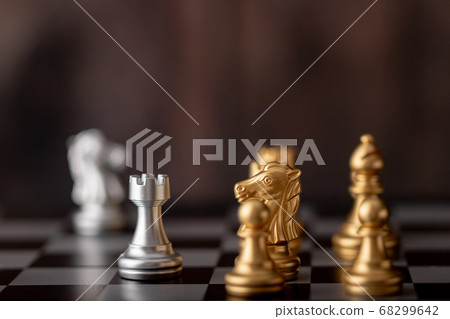 Silver and gold chess on the board Silver and gold chess on the board 68299642