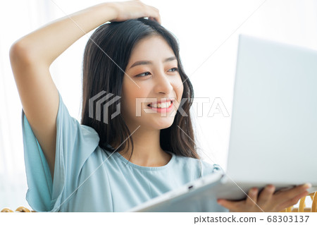 woman working and studying at home woman working and studying at home 68303137