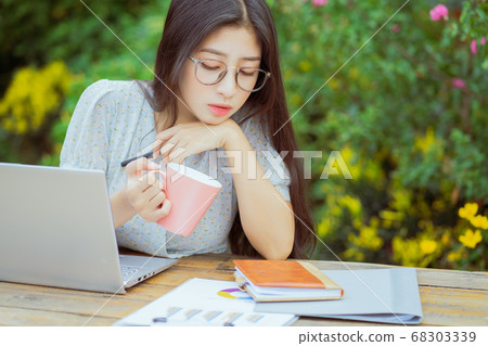 the woman is working in the garden 68303339