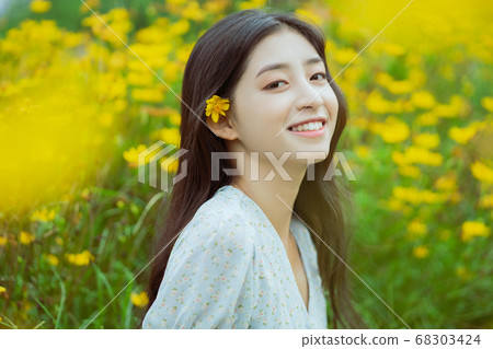woman in the flower garden woman in the flower garden 68303424