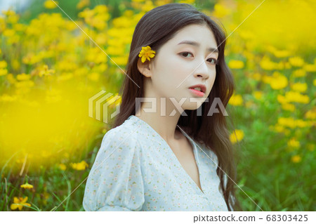 woman in the flower garden woman in the flower garden 68303425