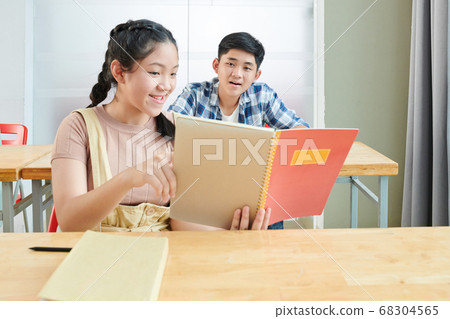 Schoolgirl sharing test answers Schoolgirl sharing test answers 68304565