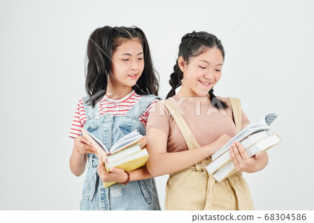Schoolgirls reading students books Schoolgirls reading students books 68304586