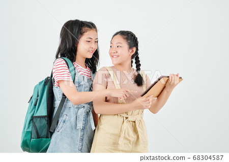 Teenage girls with digital tablet Teenage girls with digital tablet 68304587