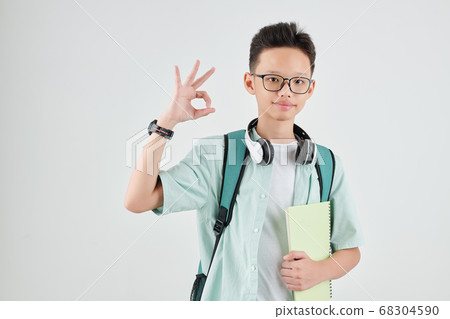 Schoolboy showing ok sign Schoolboy showing ok sign 68304590