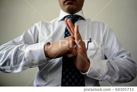 Close-up of businessman posing for greeting Close-up of businessman posing for greeting 68305733
