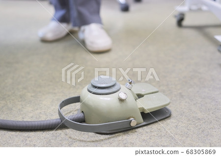 Dental chair foot pedal, close-up medical equipment in dentist office Dental chair foot pedal, close-up medical equipment in dentist office 68305869