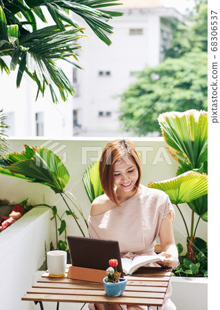 Young woman reading book Young woman reading book 68306537