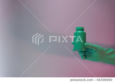 Beautiful hand hold Green bottle for pills in the Beautiful hand hold Green bottle for pills in the 68306900