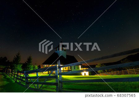 Night sky with shiny stars and church in the garden Night sky with shiny stars and church in the garden 68307565