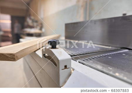 Background carpentry woodworking woodshop, machines and tools, wooden boards Background carpentry woodworking woodshop, machines and tools, wooden boards 68307883